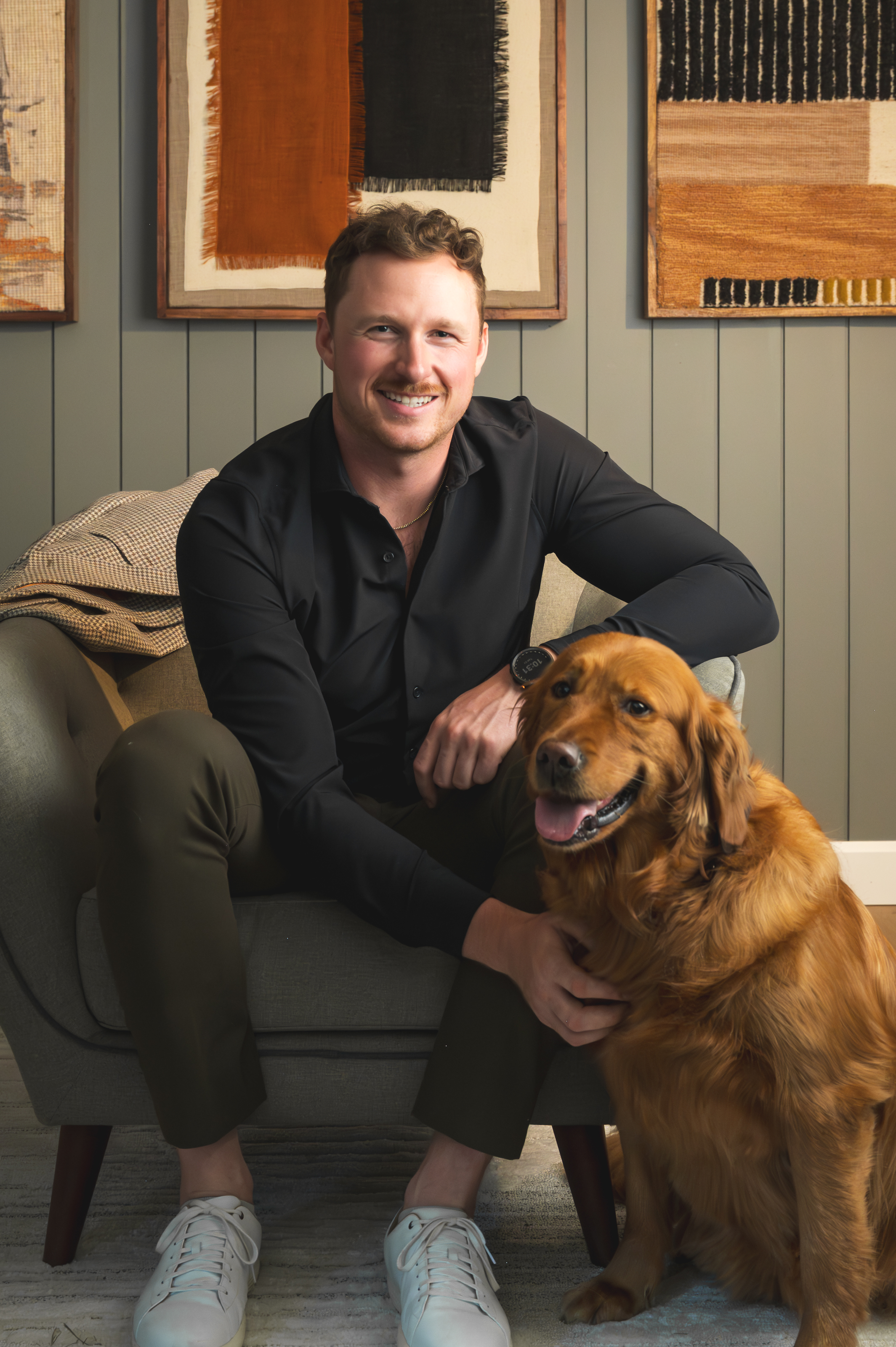 Mitch Myers smiling with his golden retriever